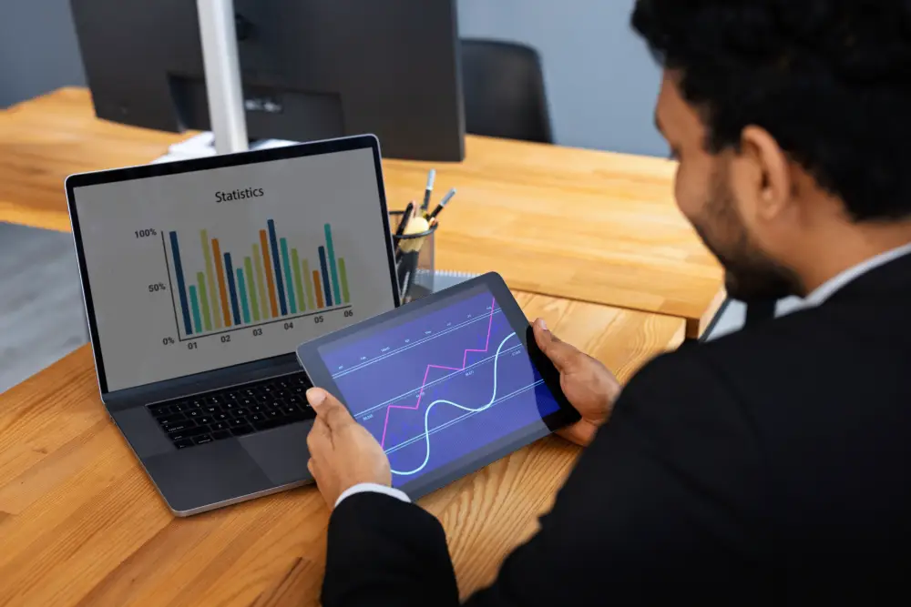 Seller working on a laptop with Amazon account management analytics and reports